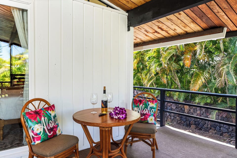 Savor local wine on your private balcony, surrounded by swaying palms and tropical charm with colorful Hawaiian touches.