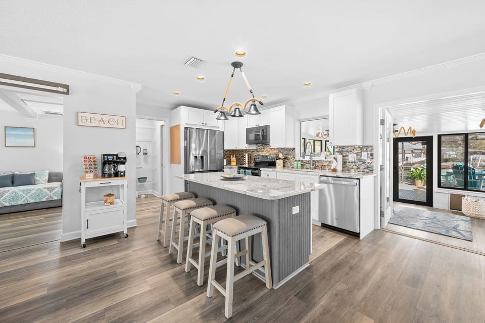 Modern kitchen with island seating and stainless appliances