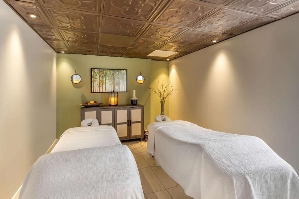 Indulge in a calming couples massage in serene comfort.