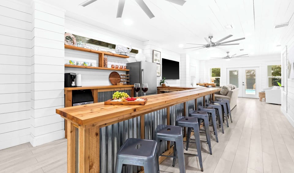 Wraparound bar: Built-in ice maker, barstool seating, lower floor
