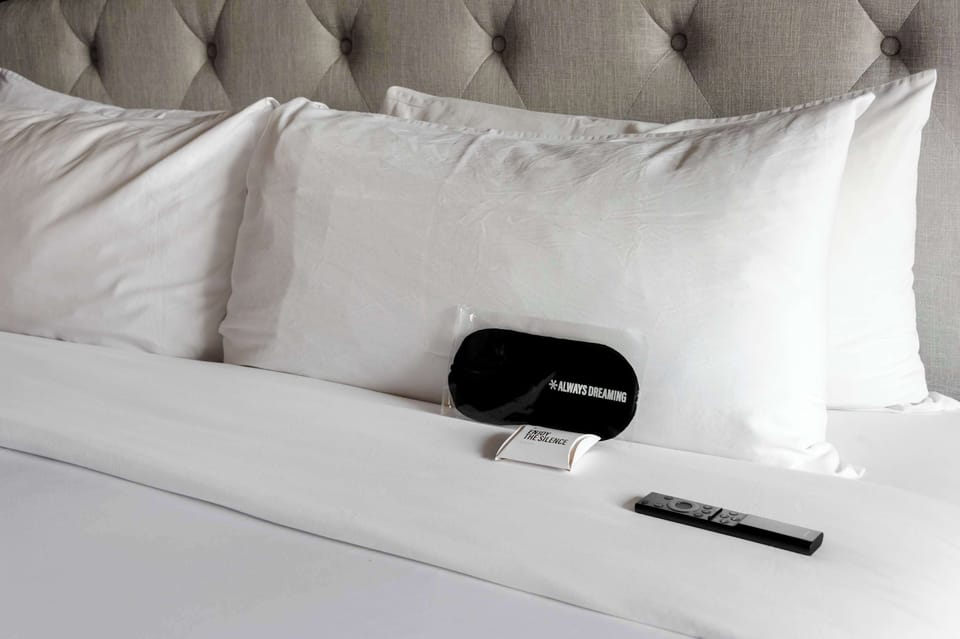Cozy bedroom with soft bedding and stylish decor.