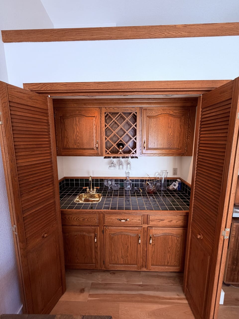 Stylish upstairs wet bar, perfect for mixing drinks or grabbing refreshments.