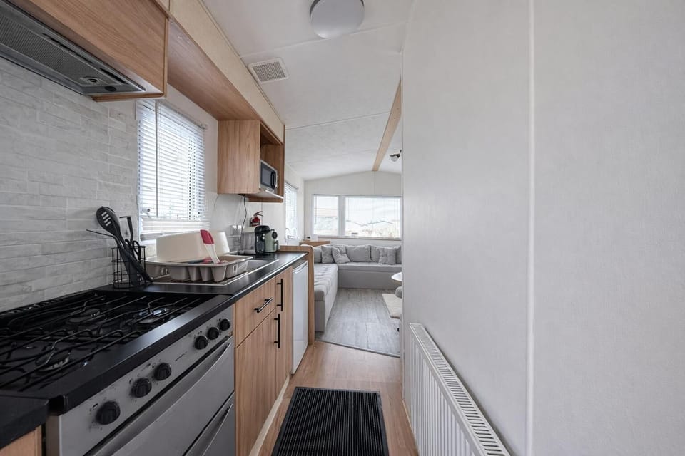 The bright modern kitchen in this caravan on Sand Le Mere is the ideal place to prepare the family favourties or grab a morning coffee.