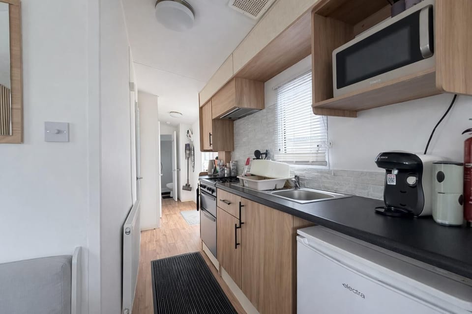 Grab a morning coffee from the kitchen and head to the small side decking to watch the world wake up each morning.