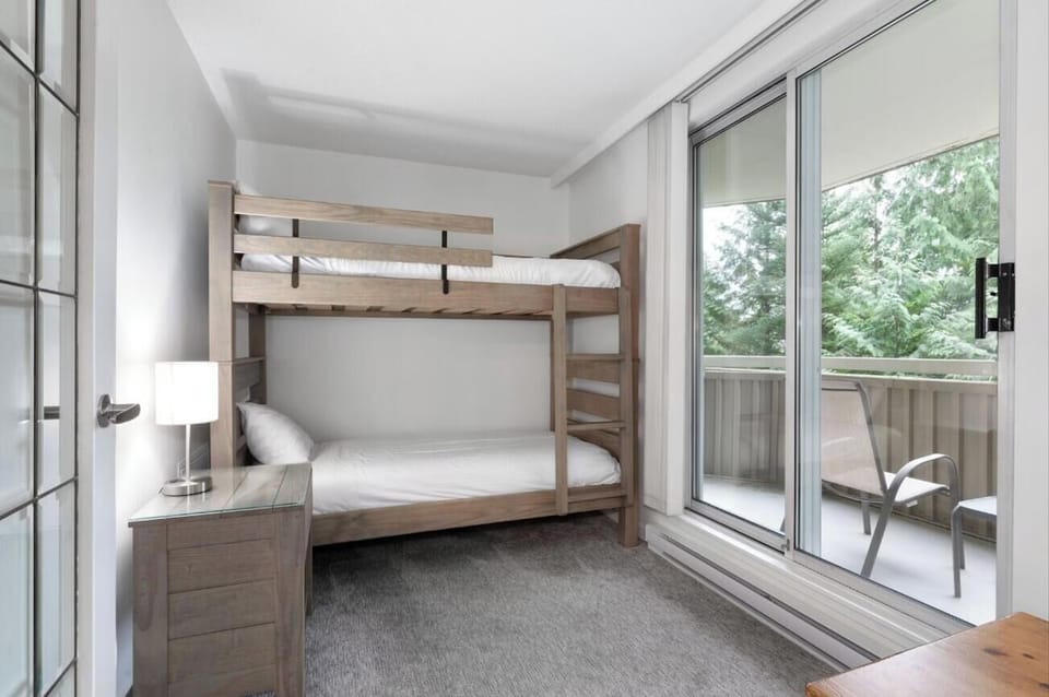 Settle into the bunk room with fresh linens and balcony access.