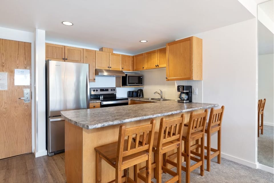 Cook together at the spacious breakfast bar with modern appliances.