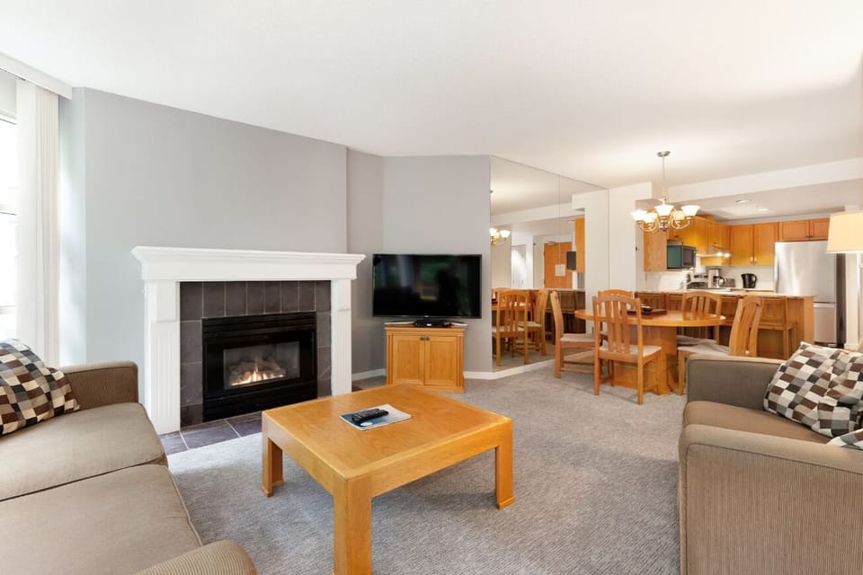 Relax with easy access to dining, kitchen, and patio door.