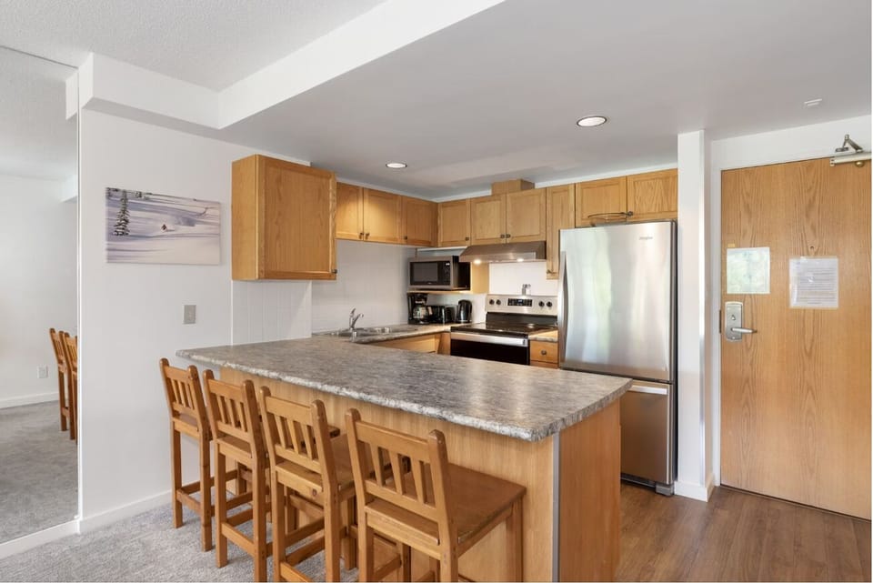 Cook with ease in the full kitchen with breakfast bar.
