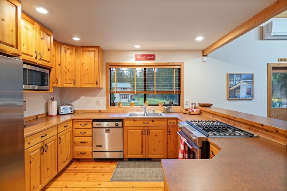 A bright and happy kitchen awaits, featuring a convenient bar seating area perfect for casual meals or socializing.