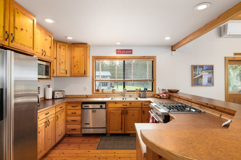 The kitchen is fully equipped with all the necessary tools and essential pantry staples.