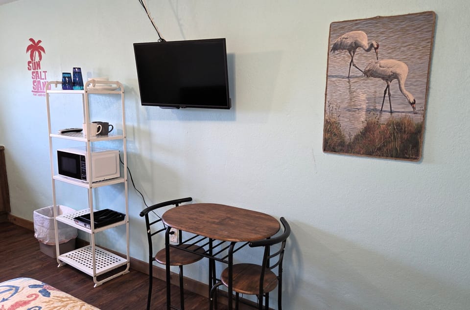 Grab a bite at the dining table.  DirecTV and wifi are included with your stay.
