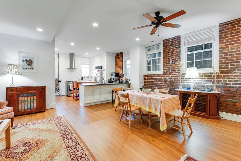 Stylish Dining Room: Unwind in chic comfort with vibrant decor and historic charm in every detail!