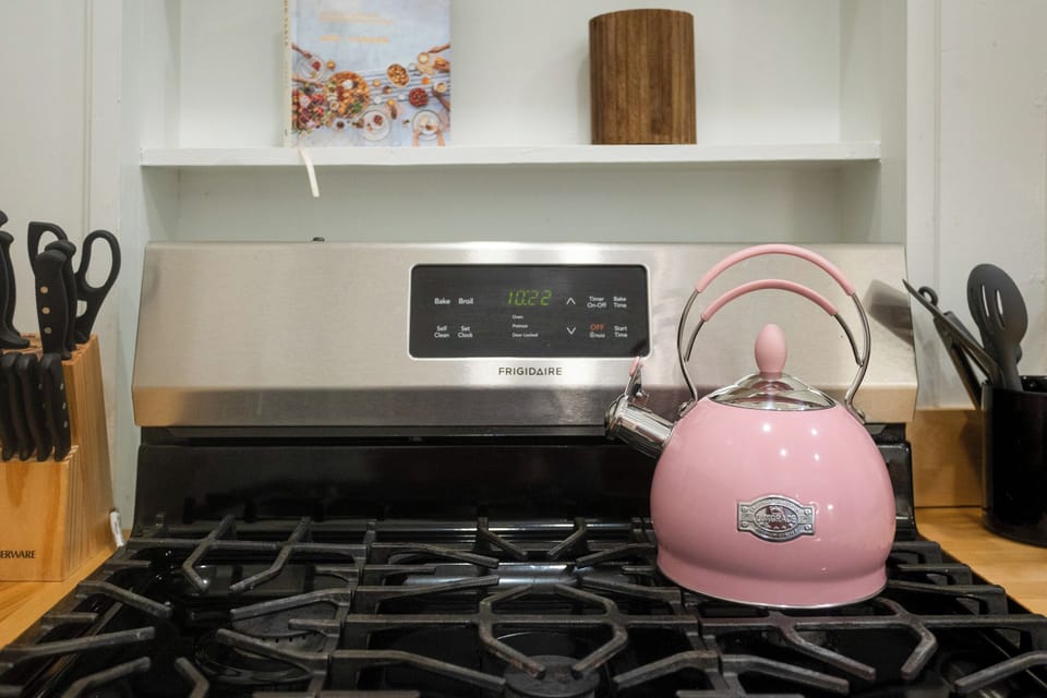The pink kettle is ready—because tea, coffee, or a little midnight ramen always sounds like a good idea.