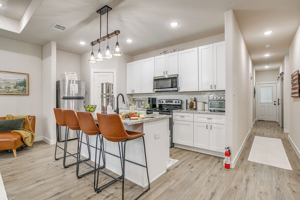 Open kitchen layout with island seating for meals, snacks, or conversation.