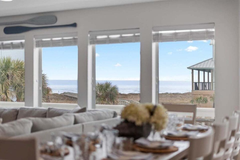 Oversized windows frame breathtaking views, bringing the beauty of the coast indoors.