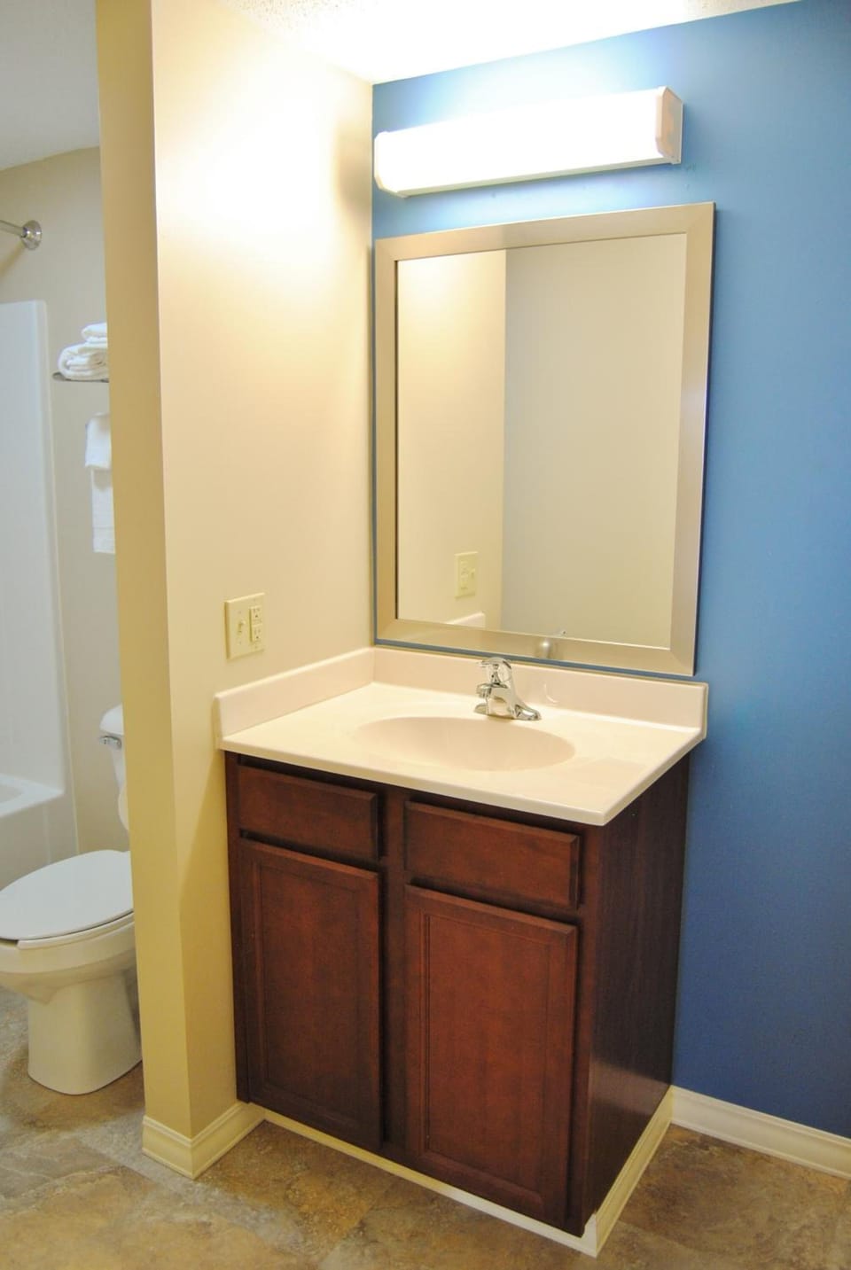 Refresh easily at a clean vanity with bright, flattering lighting.