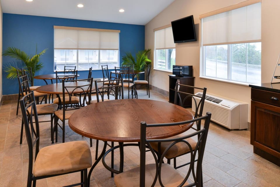 Gather together for easy meals in the airy breakfast room.