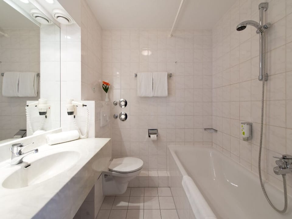 Refresh yourself in a bright, spotless bath with tub.
