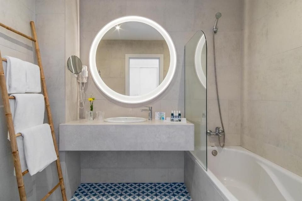 Refresh easily with a glowing mirror and spa-like vanity.