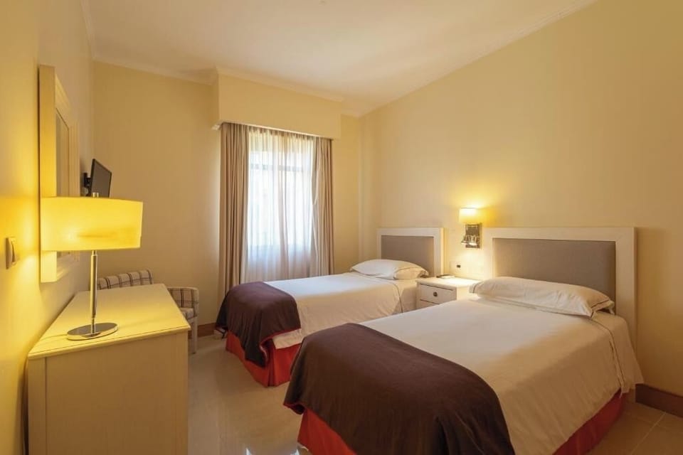 Settle in comfortably with twin beds for flexible sleeping arrangements.