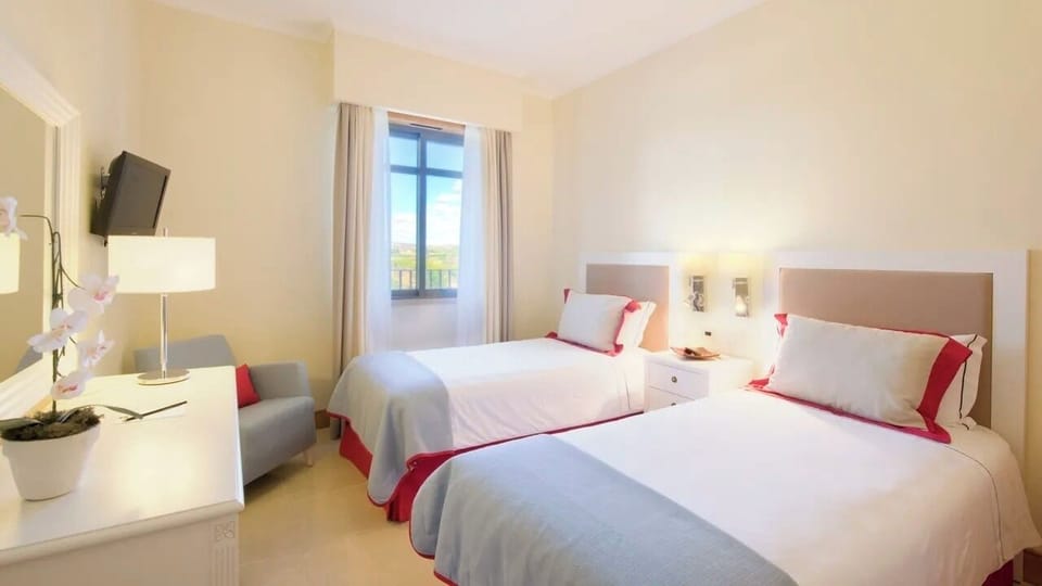 Unwind in bright twin beds with calming, airy comfort.