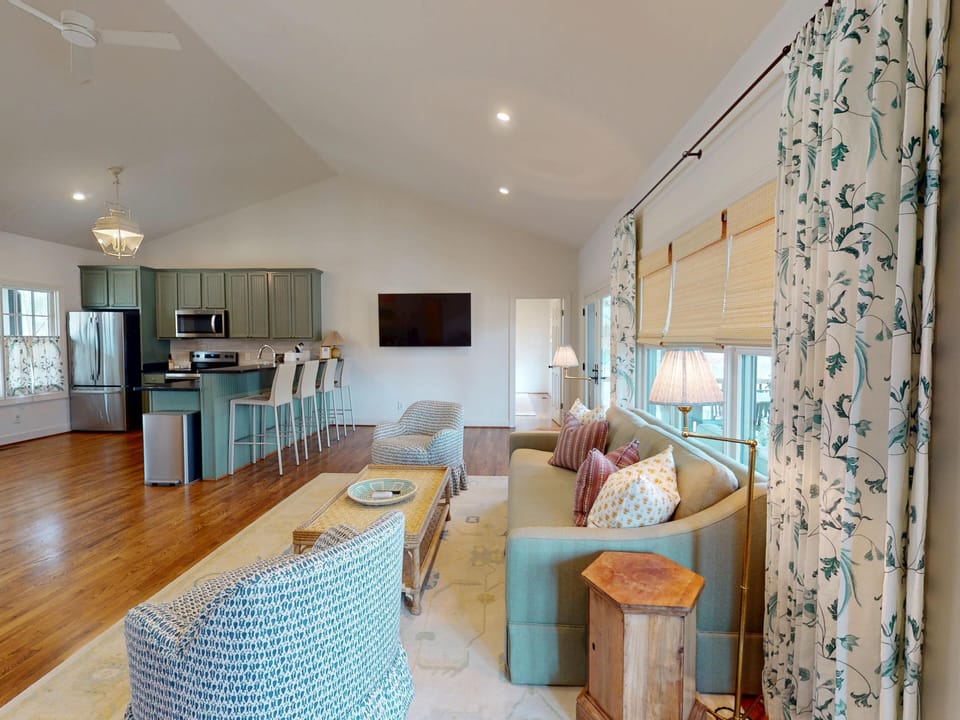 The living area features a 72" TV.