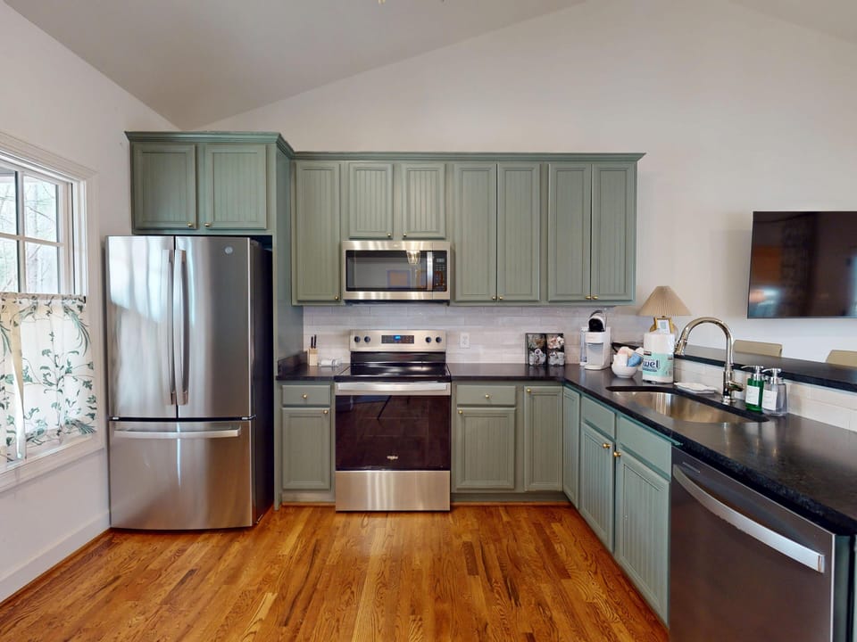 Kitchen features electric stove, dishwasher, French door fridge, and full starter pack. 