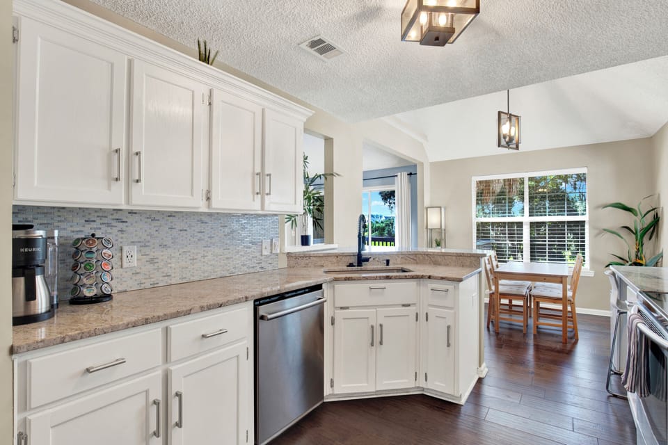 Clean lines, stainless steel, and natural light—your perfect space to cook and gather