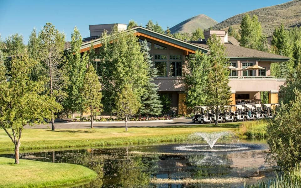 Relax beside the peaceful pond and manicured resort lawns