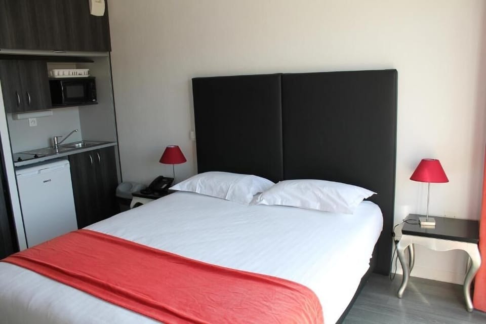 Settle into a cozy room with handy kitchenette convenience.