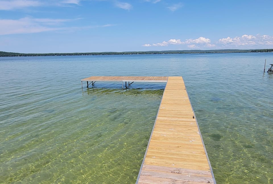 OVERVIEW:  The home includes a fantastic private dock on Big Platte Lake!