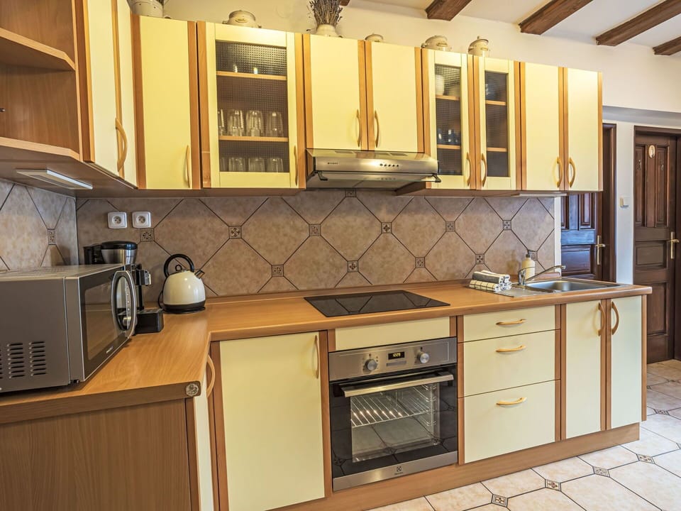 Kitchen, Countertop, Kitchen Appliance, Cabinetry, Major Appliance, Wood, Interior Design, Flooring, Furniture, Kitchen Stove