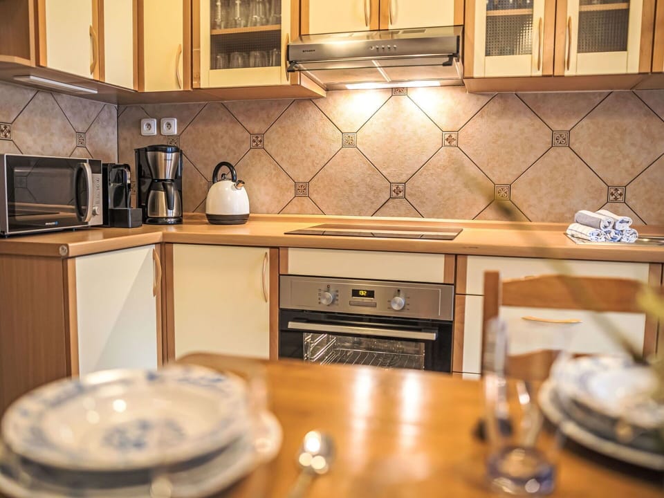 Kitchen, Kitchen Appliance, Countertop, Cabinetry, Major Appliance, Interior Design, Wood, Flooring, Kitchen Stove, Home Appliance
