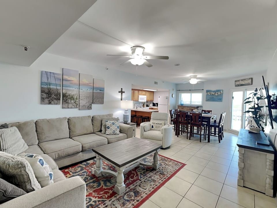 Living Area - Sectional Sofa and Access to Private Balcony