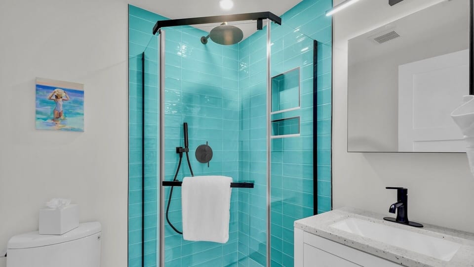Featuring a glass walk-in shower...
