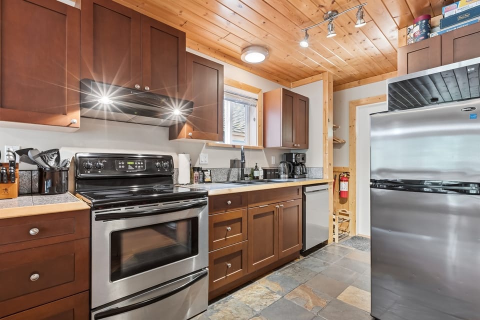 Spacious kitchen fully equipped with all the essentials you need to prepare meals during your stay.