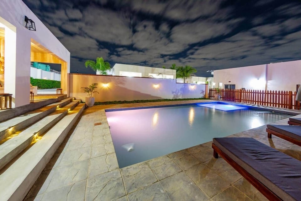 Shared swimming pool with evening lighting 