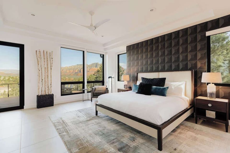 Wake up to breathtaking mountain views from your luxurious bedroom, where crisp linens and modern design create the perfect retreat.