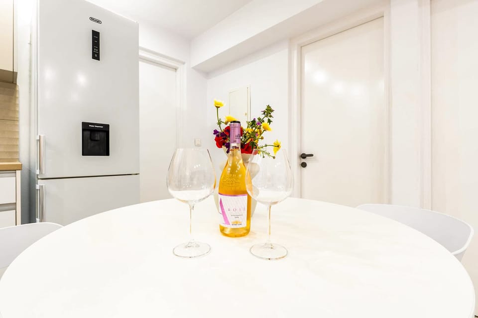 Bright dining table with fresh flowers and minimalist décor