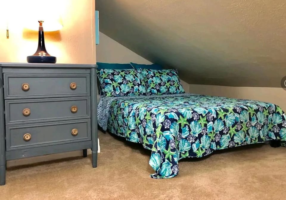 Loft w/full size bed, lamp & chest, low head clearance, must climb steep steps 