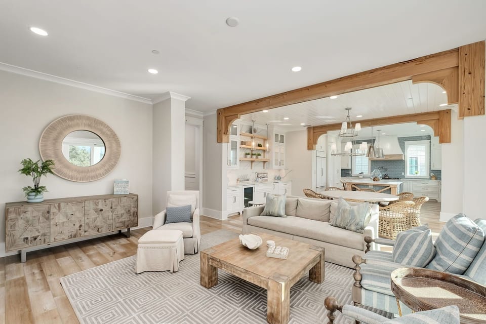 Sink into this elegant open-concept living space where coastal charm meets modern comfort, perfect for your relaxing getaway.