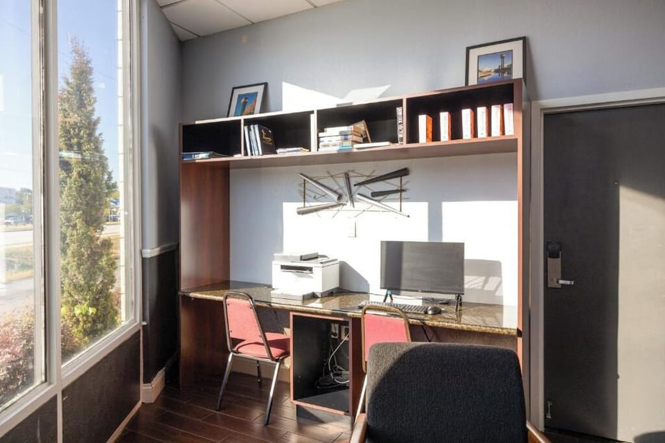 Work comfortably with a dedicated desk setup and natural light.