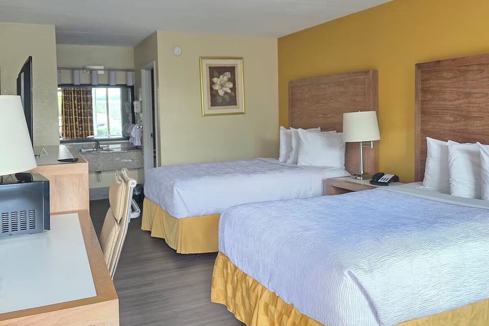 Stretch out comfortably with two plush beds and warm lighting.