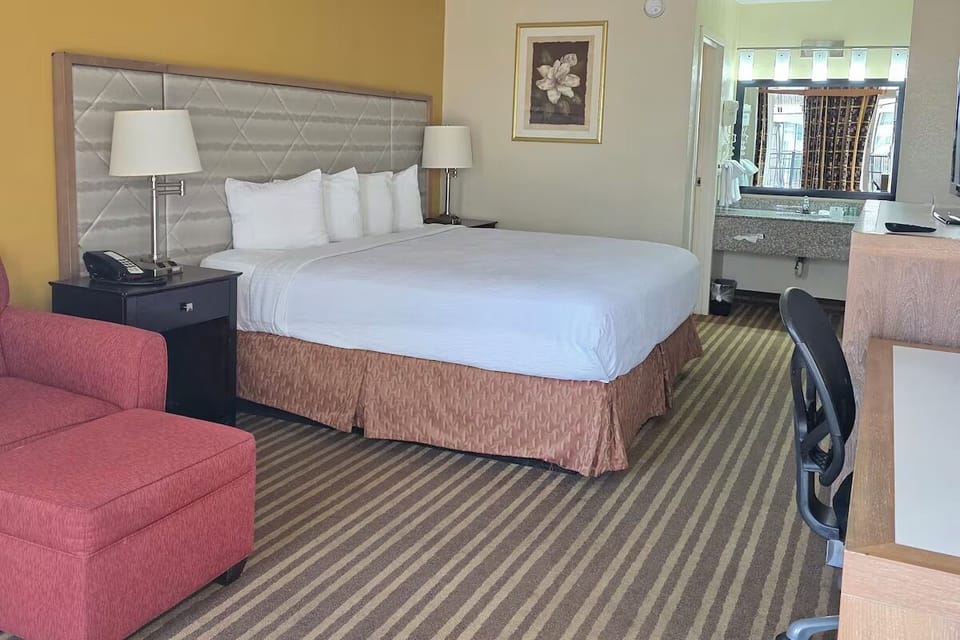 Sink into crisp linens and enjoy a calm, spacious layout.