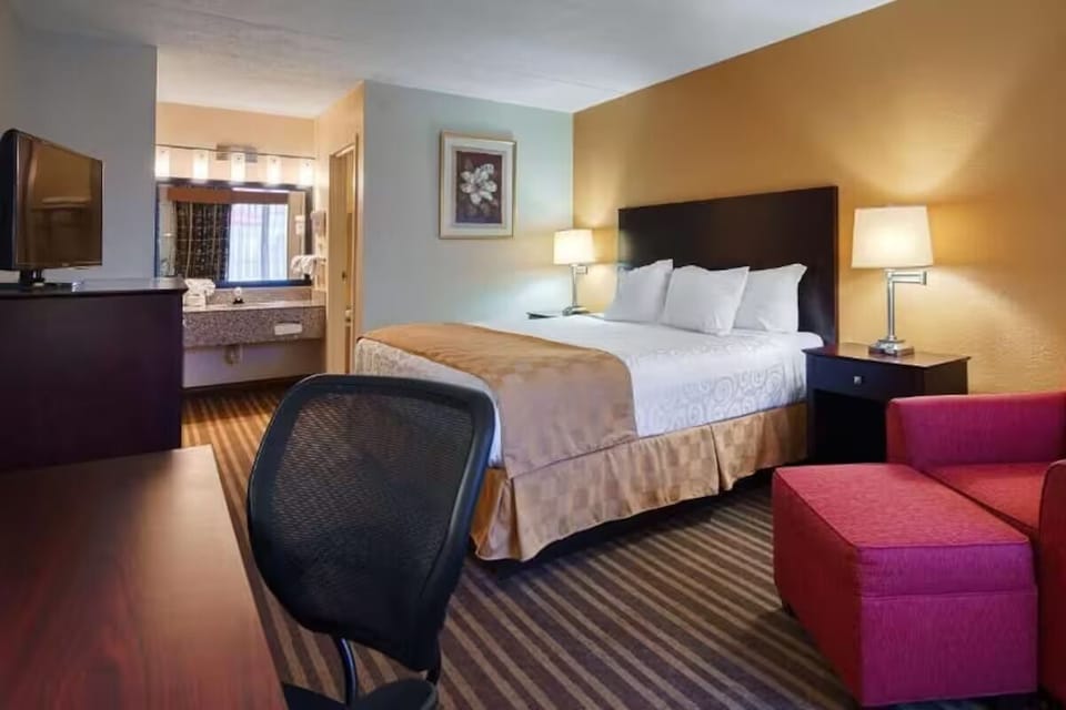 Unwind in a bright king room with cozy lounge seating.