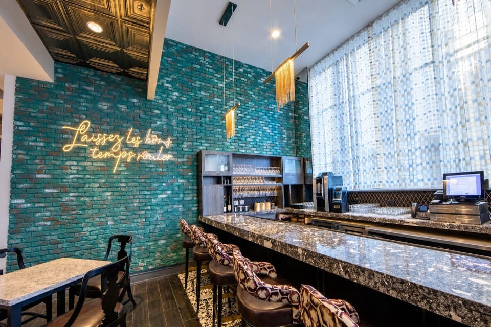 Sip and settle in at the polished bar with plush seating.