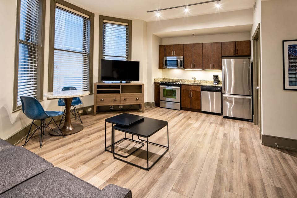 Cook with ease in the sleek kitchen, then dine by windows.