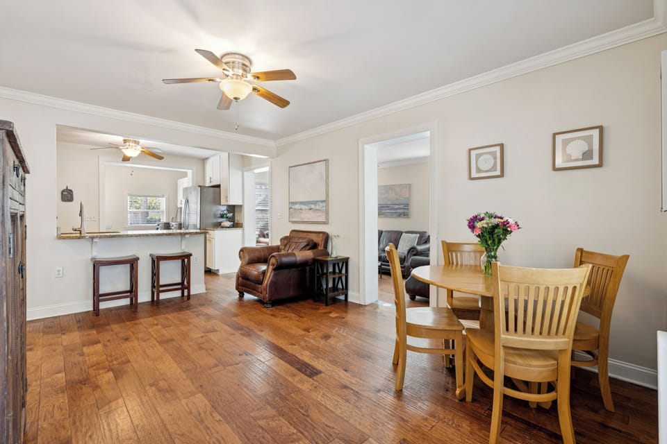 Gather around your dining table while the open kitchen design keeps you connected to family conversations.