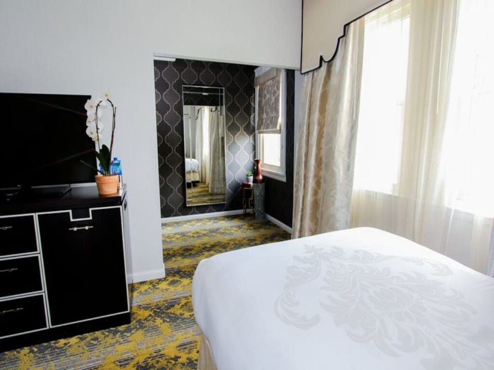 Wake up to natural light and a crisp, inviting bed.