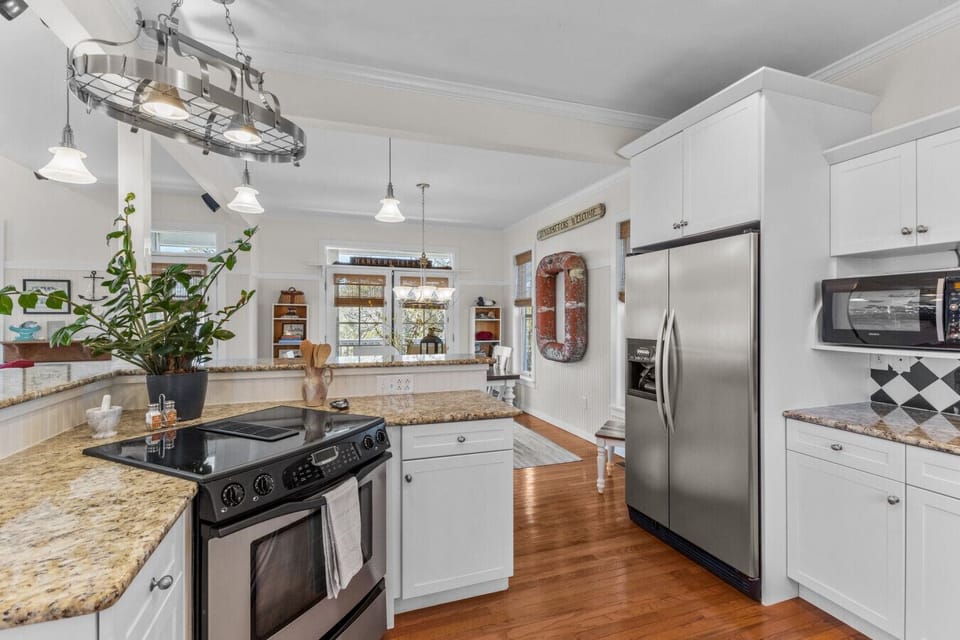Fully stocked, spacious kitchen with plenty of prep space—perfect for cooking big family meals and gathering together during your Harkers Island getaway.